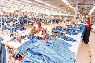 Employees make clothes for export at a textile and garment company in My Hao district, Hung Yen province, Vietnam, on 29 March 2022. PHOTO: VNA/HANDOUT VIA XINHUA/FILE