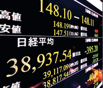 Financial data display in Tokyo on 8 October 2024 shows the 225-issue Nikkei Stock Average ending lower than the previous day. PHOTO: KYODO