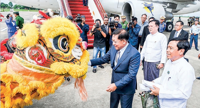 Senior General Min Aung Hlaing being welcomed back by Chinese traditional dragon and lion dance troupes at the Tatmadaw Airport in Nay Pyi Taw on 10 November 2024