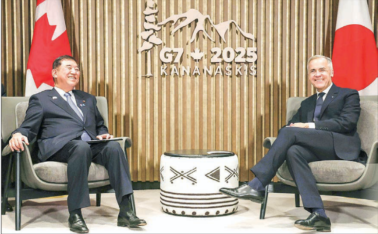 Japan, Canada leaders discuss uncertain economy, trade