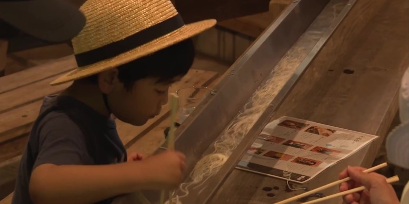 Visitors to Japanese valley cool down with water-streamed noodles