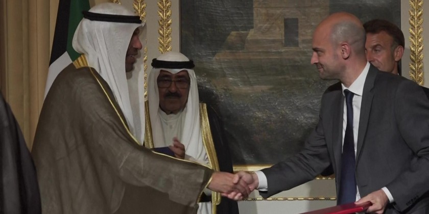 Macron attends an agreement signing ceremony with Kuwait