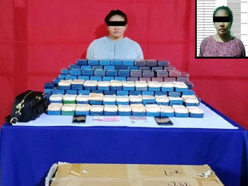 ပြစ်မှုကျူးလွန်သူများအား ဖမ်းဆီးရမိသည့် ဘိန်းဖြူများနှင့်အတူ တွေ့ရစဉ်။