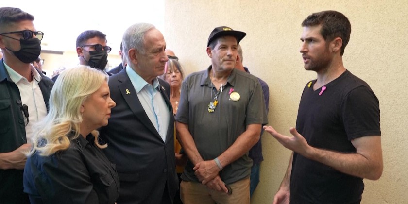 Netanyahu vows at stricken kibbutz to bring hostages home