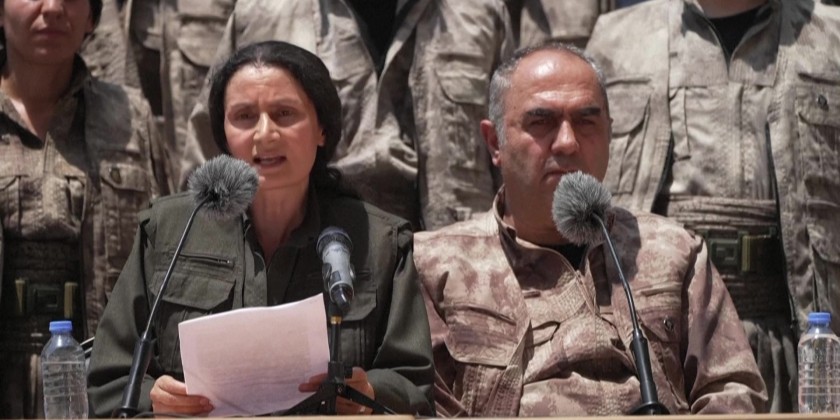 Kurdish PKK fighters destroy weapons at disarmament ceremony