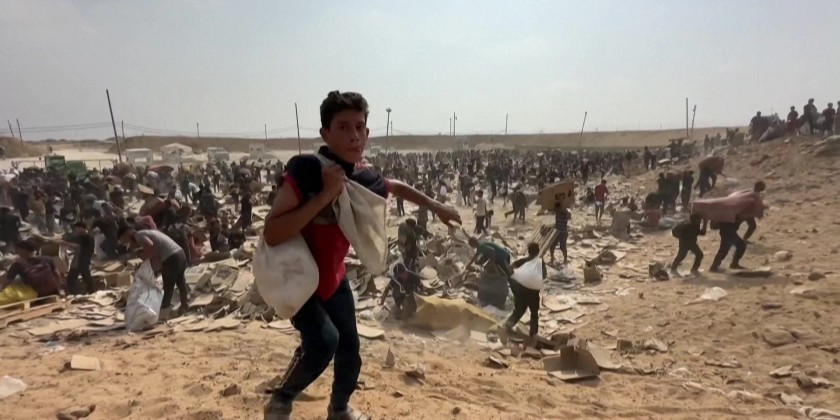 Palestinians flock to distribution point to gather aid in central Gaza