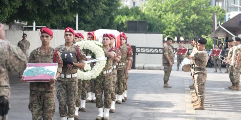 Relatives and officers attend funeral of Lebanese soldier killed in blast at Hezbollah site