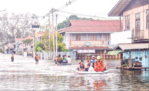 This photo shows rescuers evacuating flood victims during the flash floods