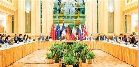 Delegation members from the parties to the Iran nuclear deal — Germany, France, Britain, China, Russia and Iran — attend a meeting at the Grand Hotel of Vienna on 19 April 2021. PHOTO: PIX FOR VISUAL PURPOSE/APA/AFP/FILE
