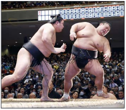 Wakamotoharu (L) defeats Takakeisho on Day 3 of the New Year Grand Sumo Tournament at Tokyo's Ryogoku Kokugikan on 16 January 2024. PHOTO: KYODO