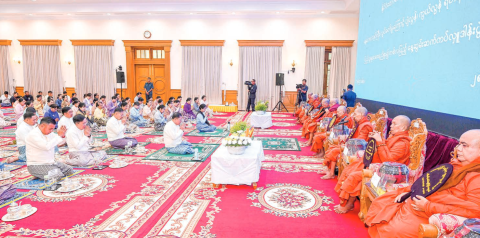 State Administration Council Chairman Prime Minister Senior General Min Aung Hlaing, wife Daw Kyu Kyu Hla, and the congregation observe the Five Precepts from members of the Sangha at the one-month memorial alms meals offering event