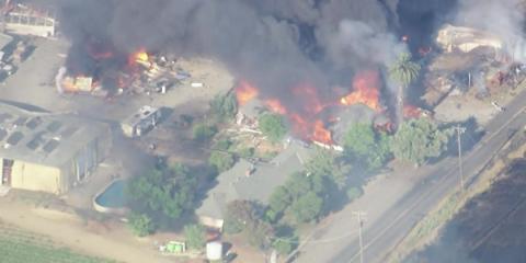 Fire breaks out after multiple explosions at California fireworks warehouse