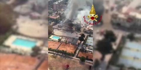 Smoke rises from the area where a petrol station exploded in Rome