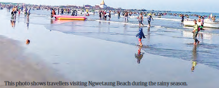 This photo shows travellers visiting Ngwetaung Beach during the rainy season.