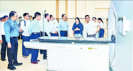 This photo depicts officials inspecting newly installed radiotherapy cancer treatment machines